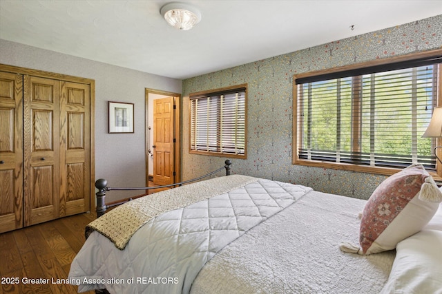 12560 Eaton Rapids Rd, Springport, MI 49284 - bedroom featuring wood-type flooring and wallpapered walls