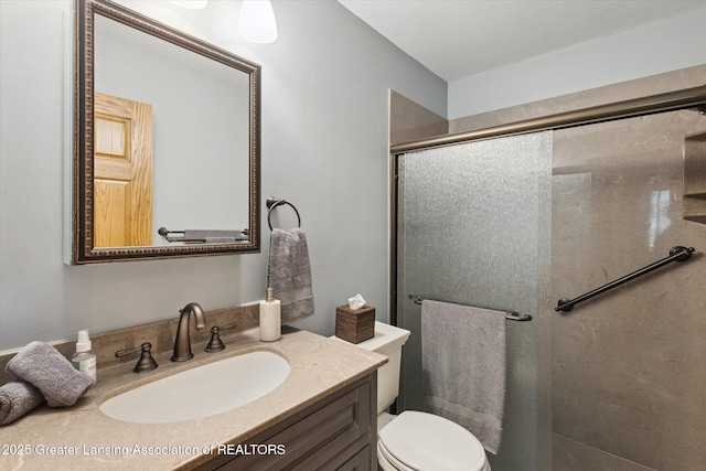 12560 Eaton Rapids Rd, Springport, MI 49284 - bathroom with a stall shower, vanity, and toilet