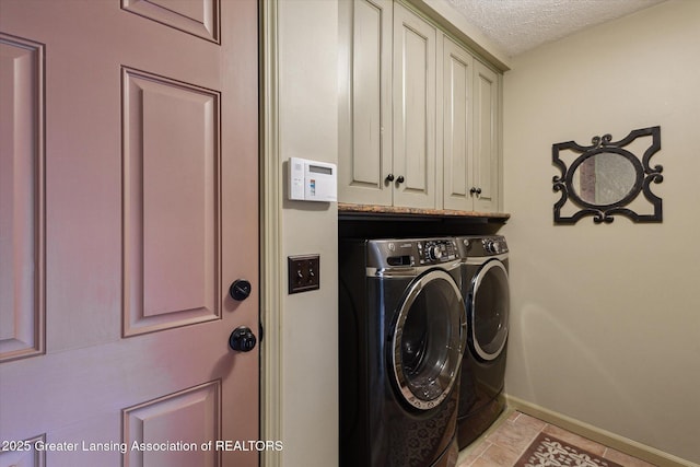 12560 Eaton Rapids Rd, Springport, MI 49284 - washroom featuring washer and clothes dryer, cabinet space, baseboards, and a textured ceiling