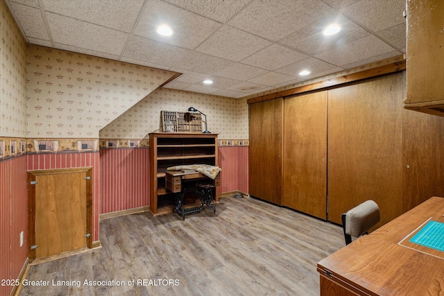 12560 Eaton Rapids Rd, Springport, MI 49284 - office featuring wallpapered walls, wood finished floors, a wainscoted wall, recessed lighting, and a paneled ceiling