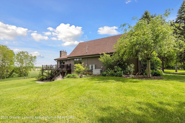 12560 Eaton Rapids Rd, Springport, MI 49284 - view of green lawn with a deck