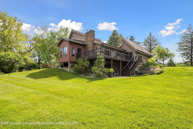 12560 Eaton Rapids Rd, Springport, MI 49284 - rear view of property with a deck, a lawn, a chimney, and stairway