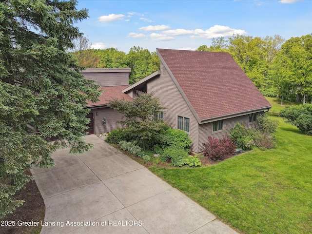 12560 Eaton Rapids Rd, Springport, MI 49284 - view of side of property featuring a yard and a shingled roof