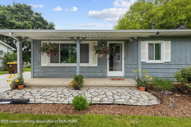 530 S Dibble Blvd, Lansing, MI 48917 - view of front of property featuring a porch and board and batten siding