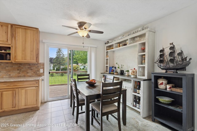 530 S Dibble Blvd, Lansing, MI 48917 - dining area featuring ceiling fan and a textured ceiling