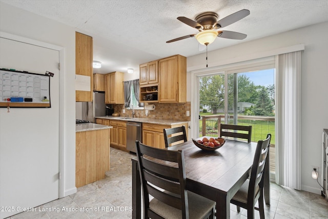 530 S Dibble Blvd, Lansing, MI 48917 - dining space featuring ceiling fan, a textured ceiling, light tile patterned floors, and baseboards