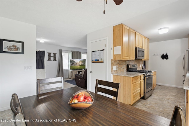 530 S Dibble Blvd, Lansing, MI 48917 - dining room with a ceiling fan and baseboards