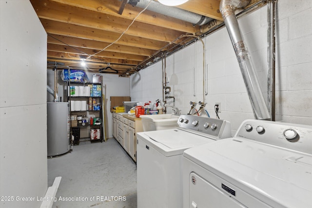 530 S Dibble Blvd, Lansing, MI 48917 - washroom featuring gas water heater, independent washer and dryer, and cabinet space