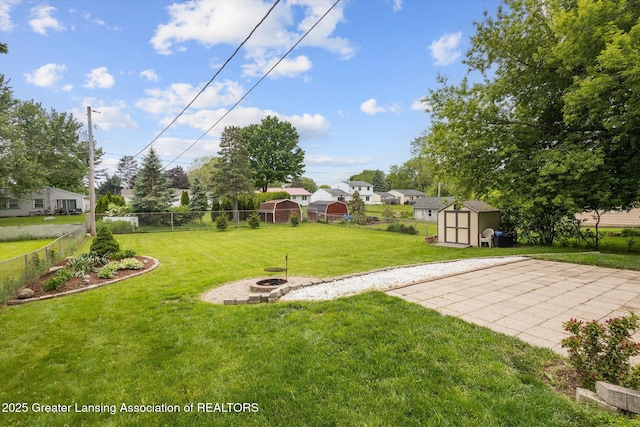 530 S Dibble Blvd, Lansing, MI 48917 - view of yard with a fire pit and a patio area