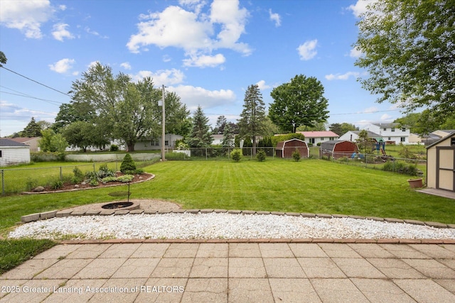 530 S Dibble Blvd, Lansing, MI 48917 - view of yard with a patio area, an outdoor fire pit, and a residential view