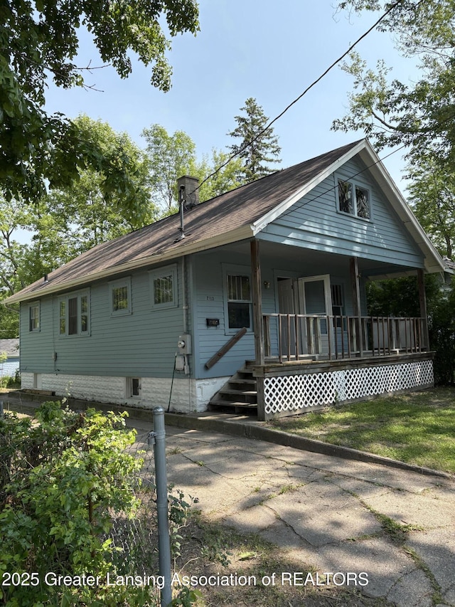 2113 S Rundle Ave, Lansing, MI 48910 - view of front of property featuring covered porch