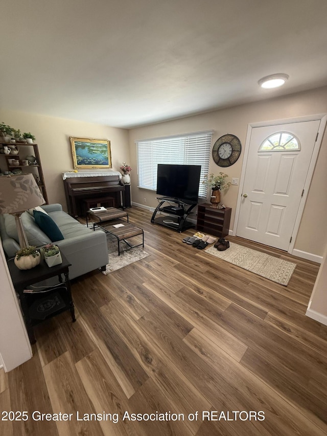 4412 Darron Dr, Lansing, MI 48917 - living room featuring wood finished floors and baseboards