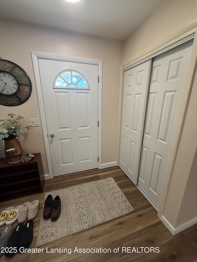 4412 Darron Dr, Lansing, MI 48917 - foyer featuring dark wood-style flooring and baseboards