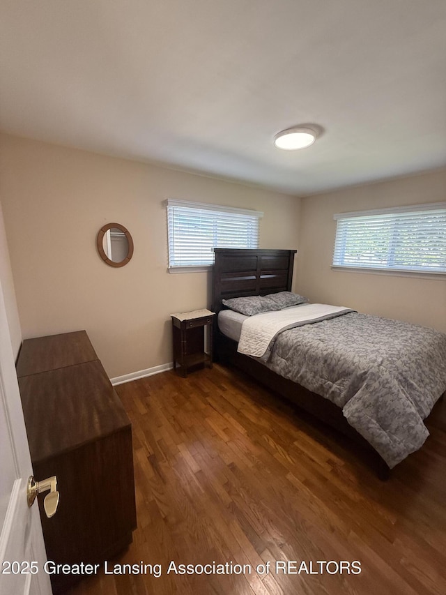 4412 Darron Dr, Lansing, MI 48917 - bedroom with wood finished floors and baseboards