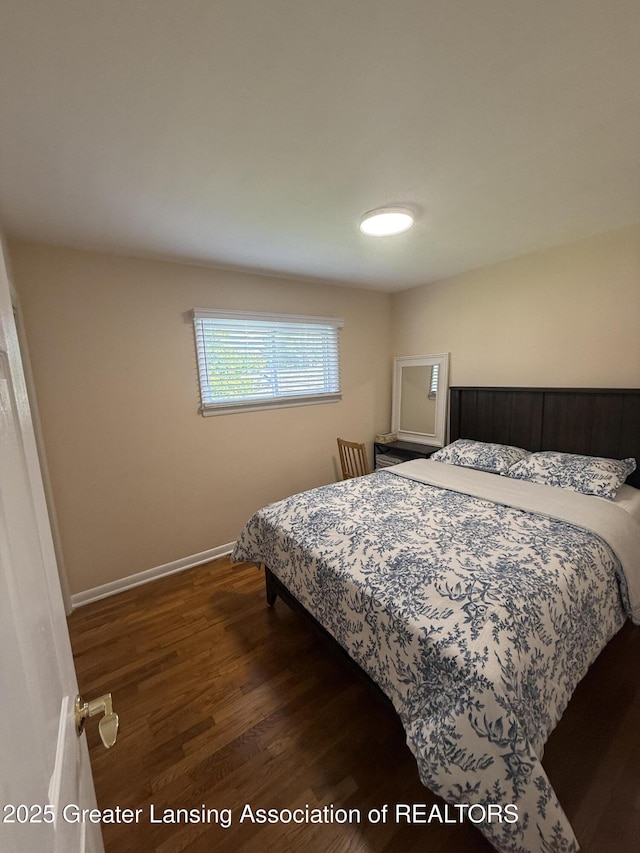4412 Darron Dr, Lansing, MI 48917 - bedroom with wood finished floors and baseboards