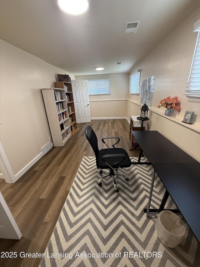 4412 Darron Dr, Lansing, MI 48917 - office space featuring dark wood-style flooring and baseboards