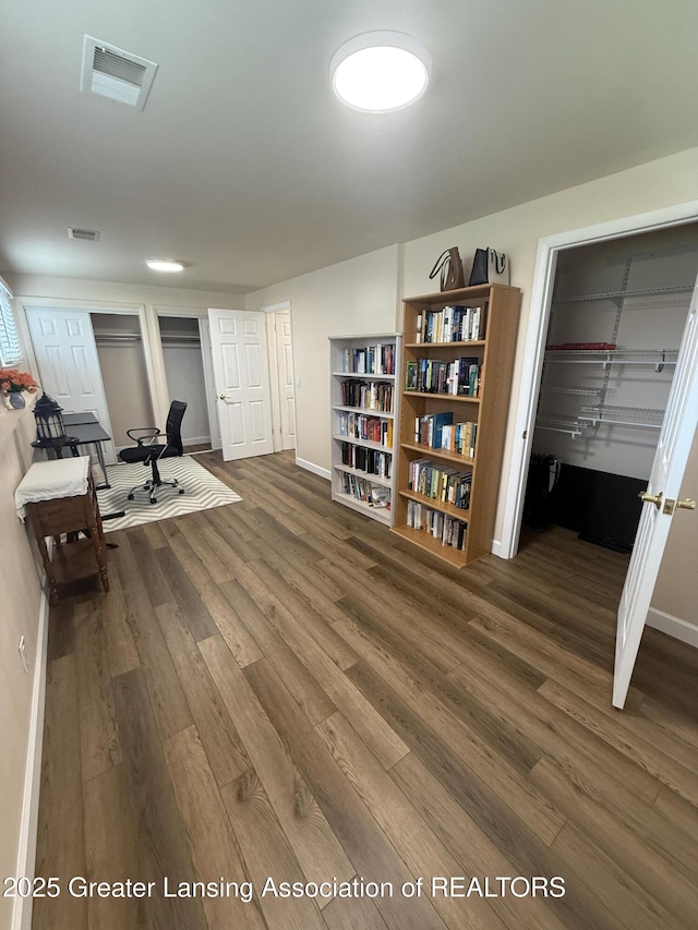 4412 Darron Dr, Lansing, MI 48917 - office space featuring dark wood finished floors and baseboards