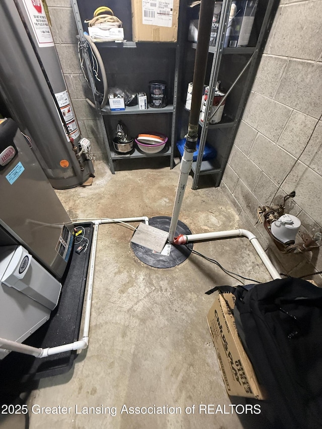 4412 Darron Dr, Lansing, MI 48917 - workout room featuring water heater and concrete block wall