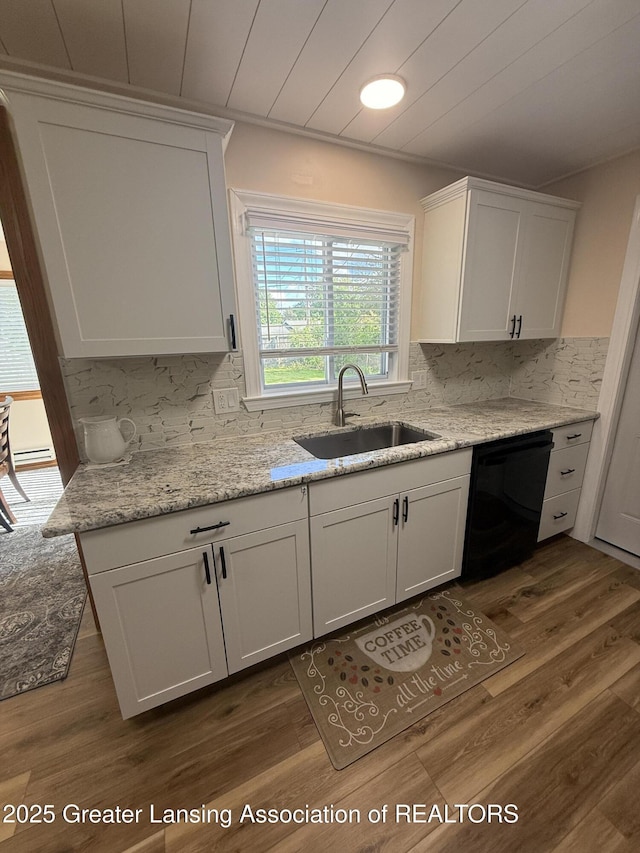 4412 Darron Dr, Lansing, MI 48917 - kitchen with a sink, black dishwasher, decorative backsplash, and white cabinets