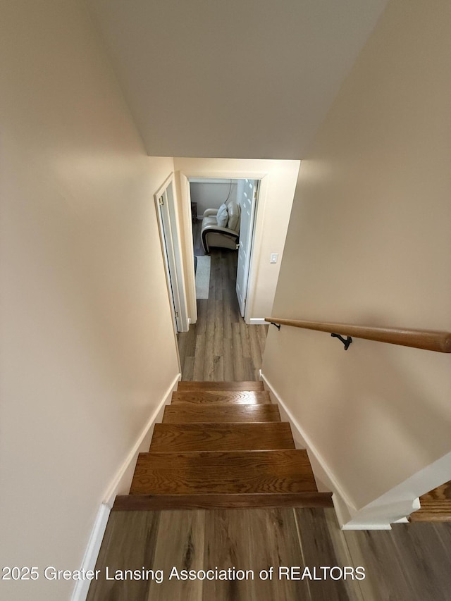 4412 Darron Dr, Lansing, MI 48917 - stairs with wood finished floors and baseboards