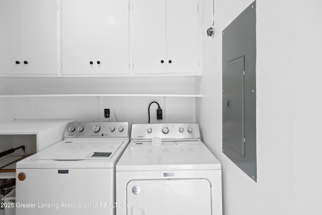 401 Julian Ave, Lansing, MI 48917 - washroom with washer and dryer, cabinet space, and electric panel