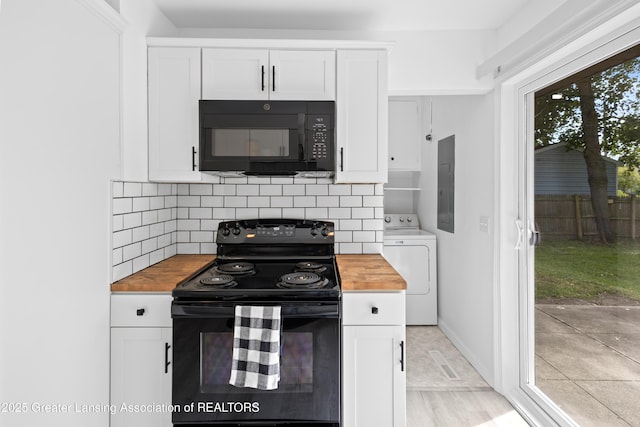 401 Julian Ave, Lansing, MI 48917 - kitchen with butcher block counters, black appliances, washer / dryer, electric panel, and backsplash