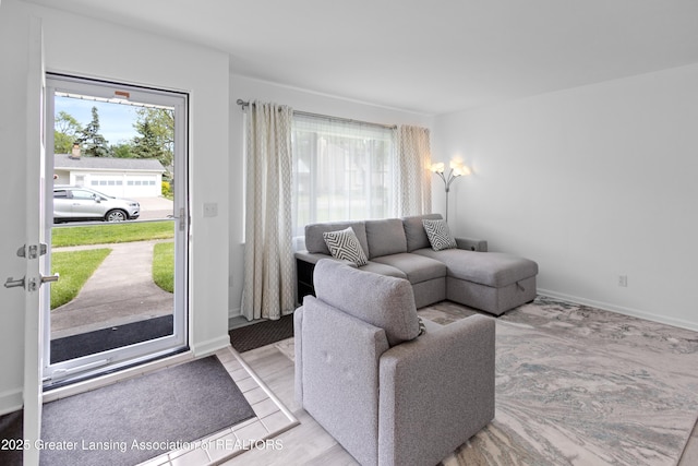 401 Julian Ave, Lansing, MI 48917 - living area featuring plenty of natural light and baseboards