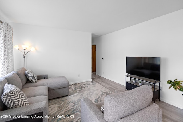 401 Julian Ave, Lansing, MI 48917 - living room featuring wood finished floors and baseboards
