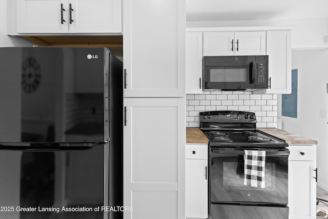 401 Julian Ave, Lansing, MI 48917 - kitchen with black appliances, light countertops, and white cabinets