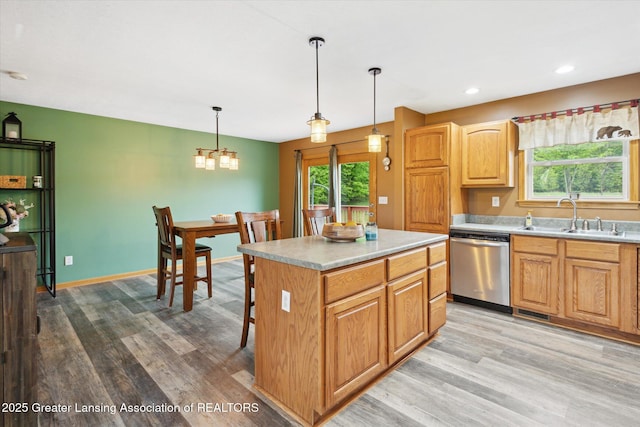 2424 S Canfield Rd, Eaton Rapids, MI 48827 - kitchen with stainless steel dishwasher, light wood-type flooring, a chandelier, light countertops, and recessed lighting