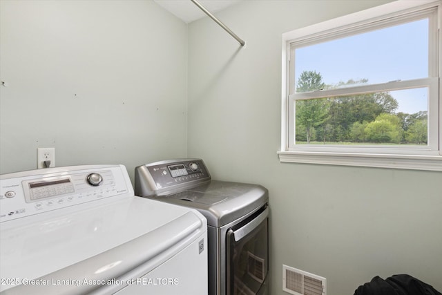 2424 S Canfield Rd, Eaton Rapids, MI 48827 - washroom with washing machine and clothes dryer