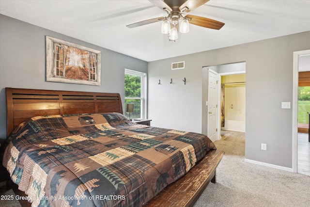 2424 S Canfield Rd, Eaton Rapids, MI 48827 - carpeted bedroom with ensuite bathroom and ceiling fan