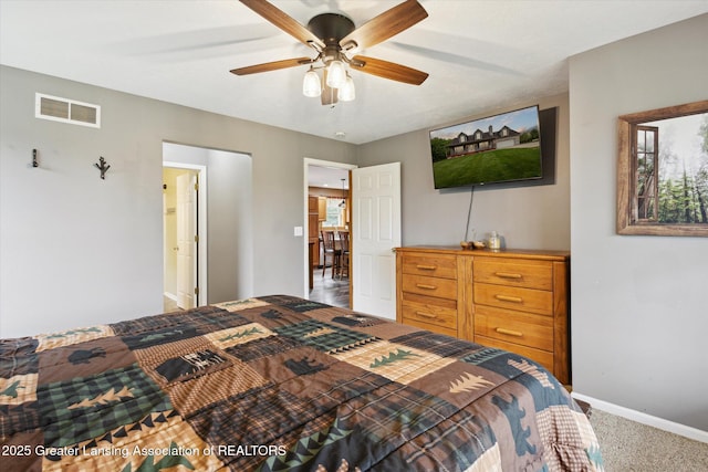 2424 S Canfield Rd, Eaton Rapids, MI 48827 - carpeted bedroom with baseboards and a ceiling fan