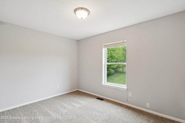 2424 S Canfield Rd, Eaton Rapids, MI 48827 - carpeted empty room with baseboards