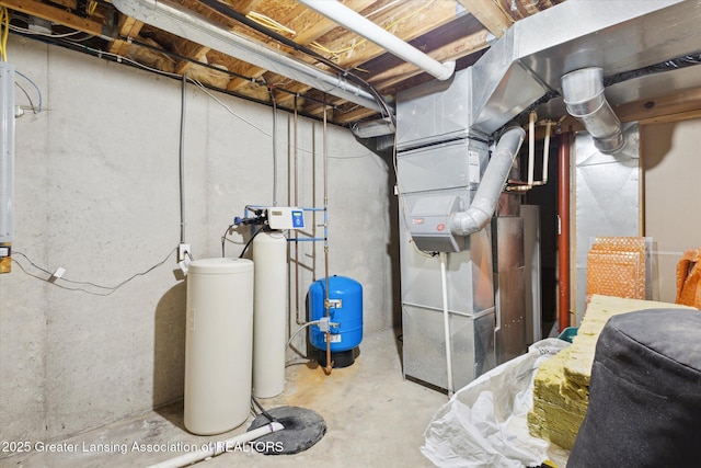 2424 S Canfield Rd, Eaton Rapids, MI 48827 - unfinished basement featuring a water softener, a water pressure tank, and heating unit