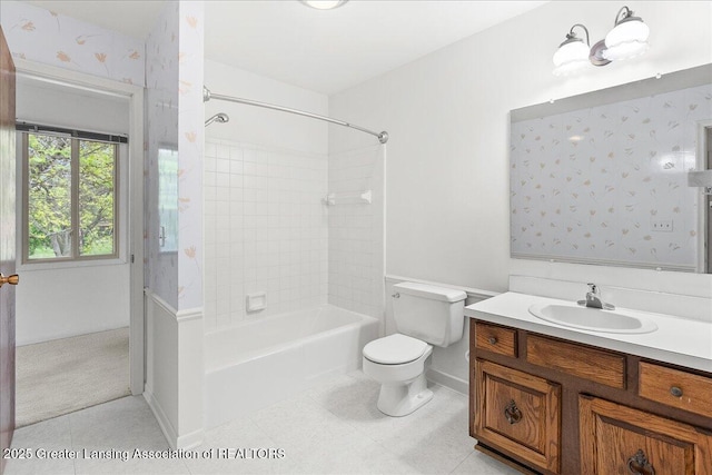 1010 Grenoble Cir, Lansing, MI 48917 - full bathroom featuring toilet, shower / bathtub combination, vanity, baseboards, and tile patterned flooring