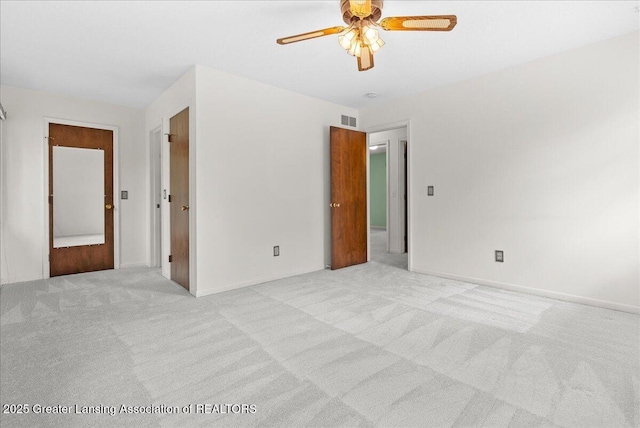 1010 Grenoble Cir, Lansing, MI 48917 - spare room with light carpet, ceiling fan, and baseboards