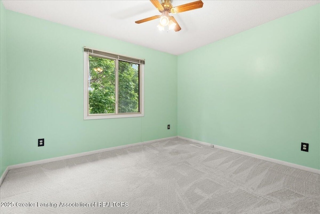 1010 Grenoble Cir, Lansing, MI 48917 - carpeted empty room featuring ceiling fan and baseboards