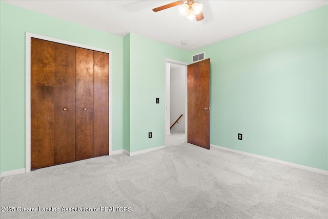 1010 Grenoble Cir, Lansing, MI 48917 - unfurnished bedroom with carpet, a closet, and baseboards
