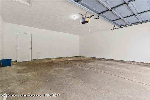 1010 Grenoble Cir, Lansing, MI 48917 - garage with a garage door opener