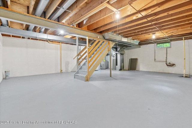 1010 Grenoble Cir, Lansing, MI 48917 - basement with stairs, heating unit, and gas water heater