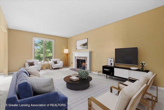 1010 Grenoble Cir, Lansing, MI 48917 - carpeted living area featuring a brick fireplace and baseboards