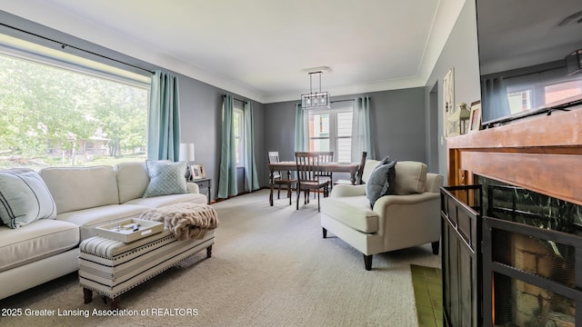 415 W Lawrence Ave, Charlotte, MI 48813 - carpeted living area with a fireplace and ornamental molding