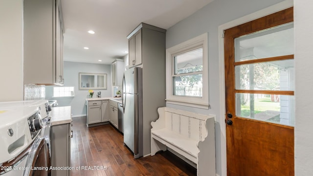 415 W Lawrence Ave, Charlotte, MI 48813 - kitchen with separate washer and dryer, gray cabinetry, dark wood finished floors, light countertops, and recessed lighting