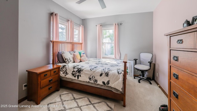 415 W Lawrence Ave, Charlotte, MI 48813 - bedroom featuring light colored carpet, ceiling fan, and baseboards