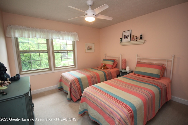5740 Bearcreek Dr, Lansing, MI 48917 - bedroom with baseboards, carpet, and ceiling fan