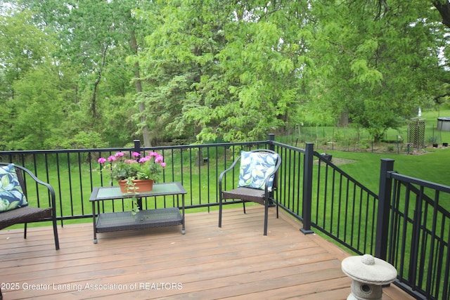 5740 Bearcreek Dr, Lansing, MI 48917 - wooden deck featuring a yard