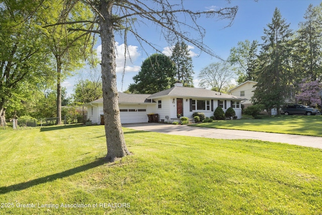 1571 Forest Hills Dr, Okemos, MI 48864 - ranch-style home with an attached garage, concrete driveway, a chimney, and a front lawn