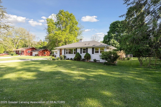 1571 Forest Hills Dr, Okemos, MI 48864 - ranch-style home with a front yard, a chimney, and roof with shingles