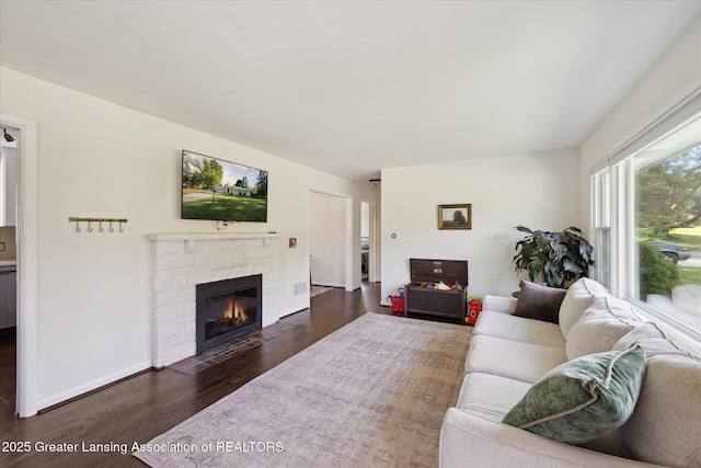1571 Forest Hills Dr, Okemos, MI 48864 - living area with dark wood finished floors and a fireplace